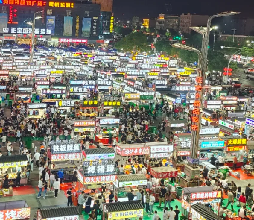 Well-lit Shijiazhuang evening street and transport area for night travel planning