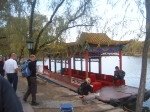 Chengde Mountain Resort lake area with a pleasure boat and visitors