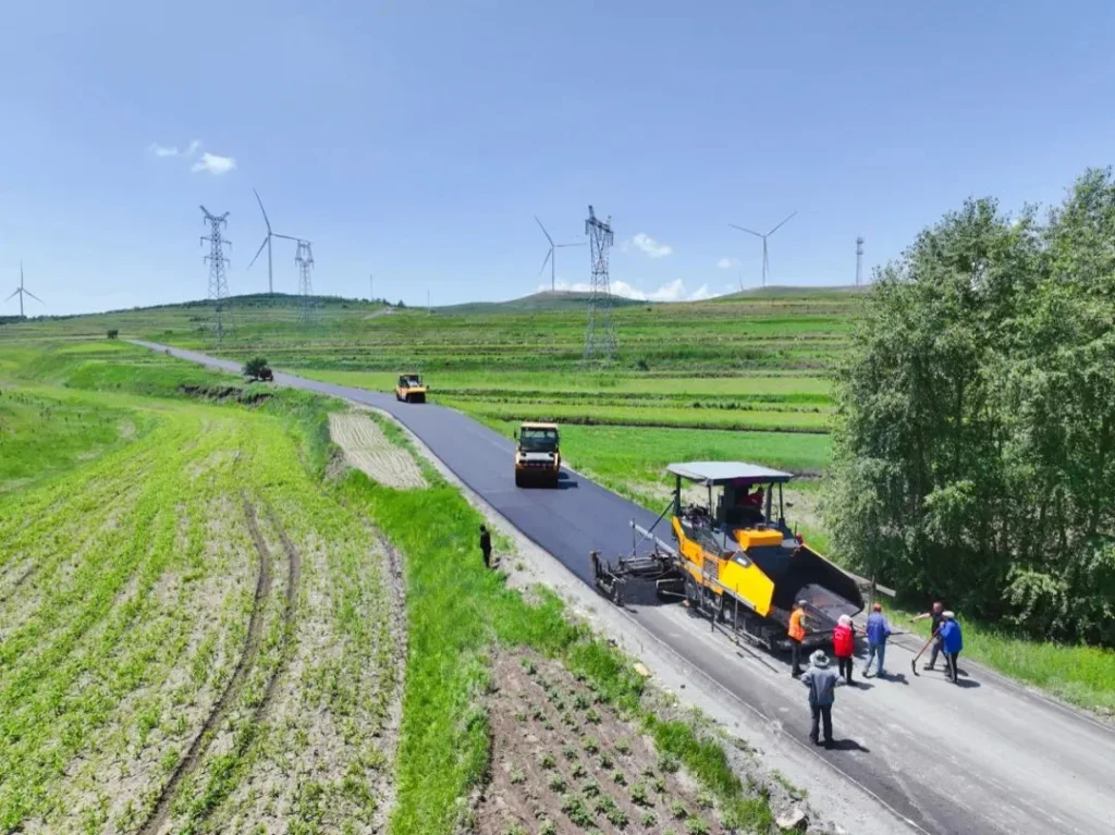 Zhangbei Grassland Road with wind turbines and green grassland