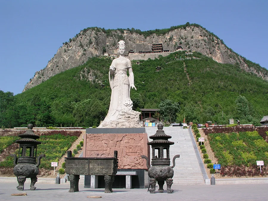 Nuwa statue with Wahuang Palace mountain buildings behind in Handan Hebei