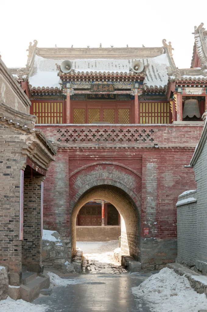 Arched gate and traditional building in Xigubao at Nuanquan Ancient Town