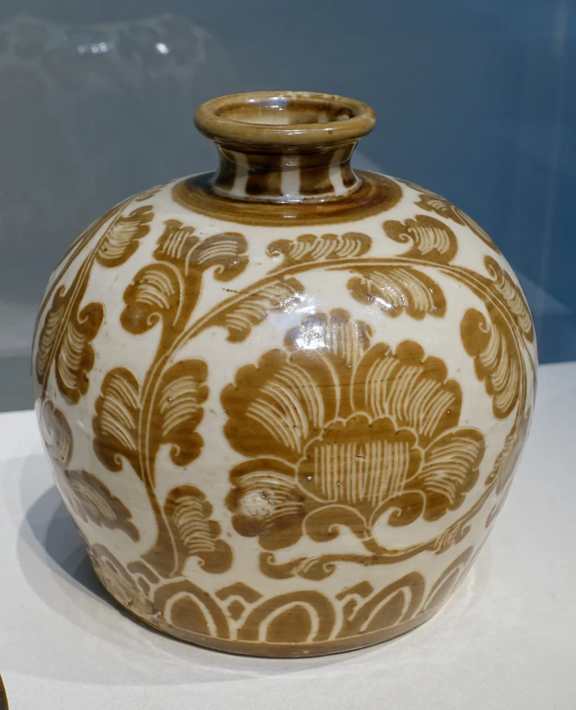 Northern Song Ding ware bottle from the Quyang Ding kilns, photographed in a museum display