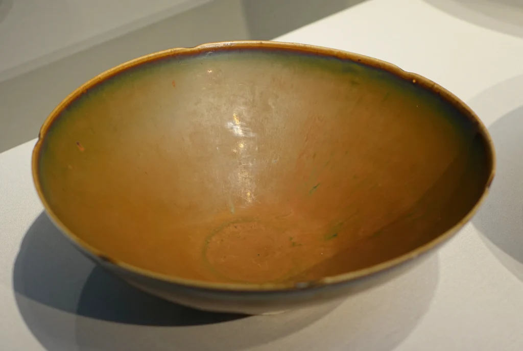 Northern Song russet Ding ware bowl from the Quyang Ding kilns, photographed in a museum display