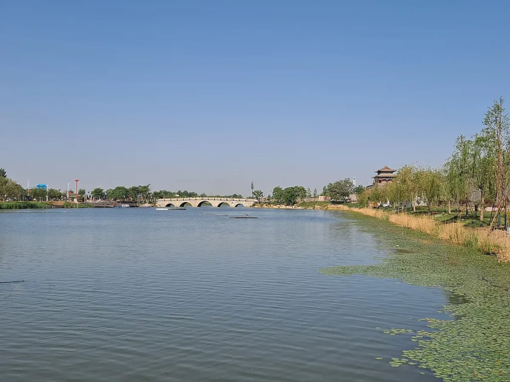 Real view of water, bridge, and city walls at Guangfu Ancient City in Yongnian, Handan
