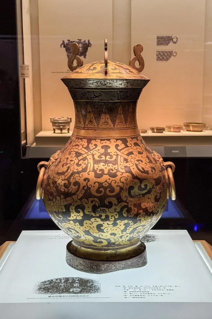 Gilt and silver bronze kettle from the Tomb of Liu Sheng at Mancheng, photographed in a museum display