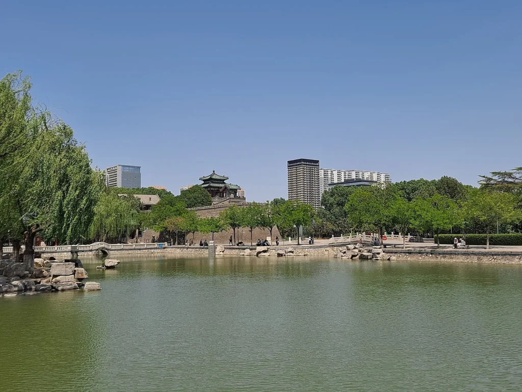 Congtai Park lake with Wuling Congtai rising beyond the water