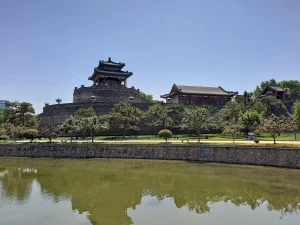 Wuling Congtai pavilion and brick terrace seen across the park water