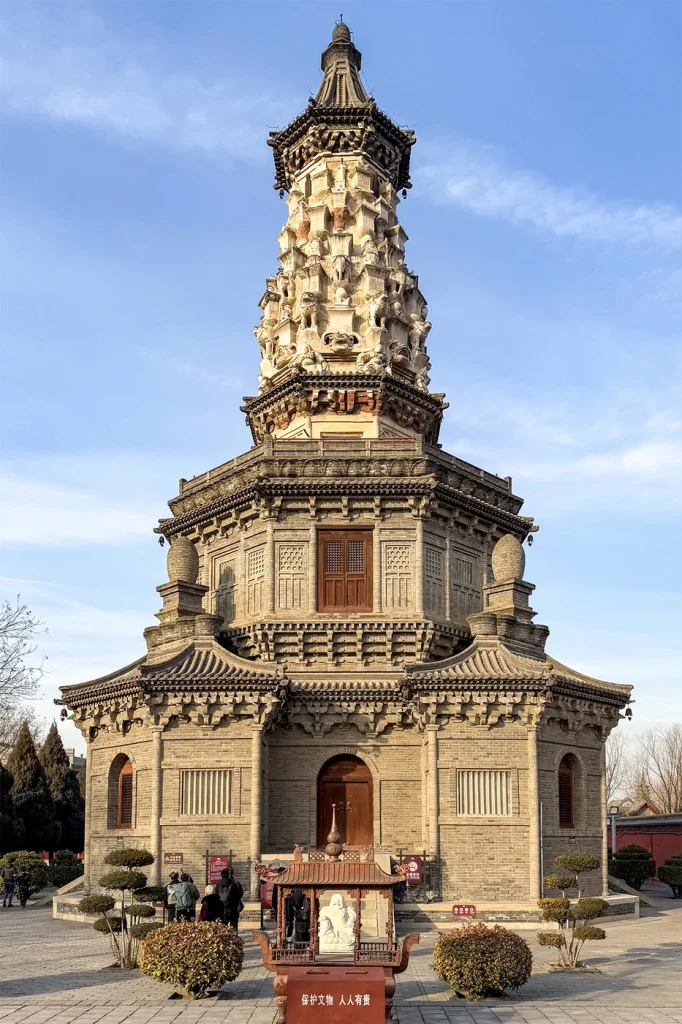 Full view of Guanghui Temple Hua Pagoda showing its small corner towers, brick eaves and sculpted upper section