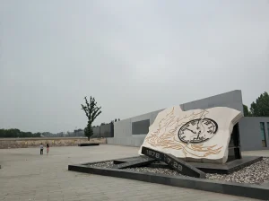 Stone memorial sculpture and open plaza at the east entrance of Tangshan Earthquake Memorial Park